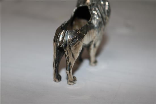 An Edwardian silver pincushion in the form of a standing lion (cushion and tail deficient),